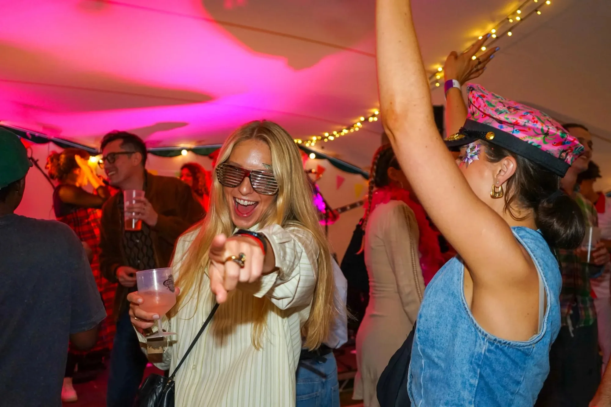 People at a lively party under colourful lights