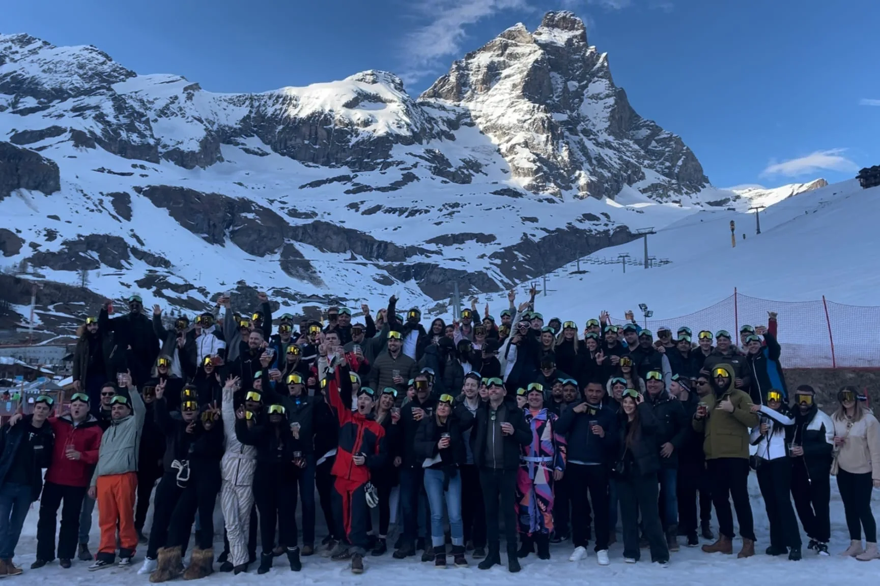 A corporate group in ski gear on an Archie's ski trip