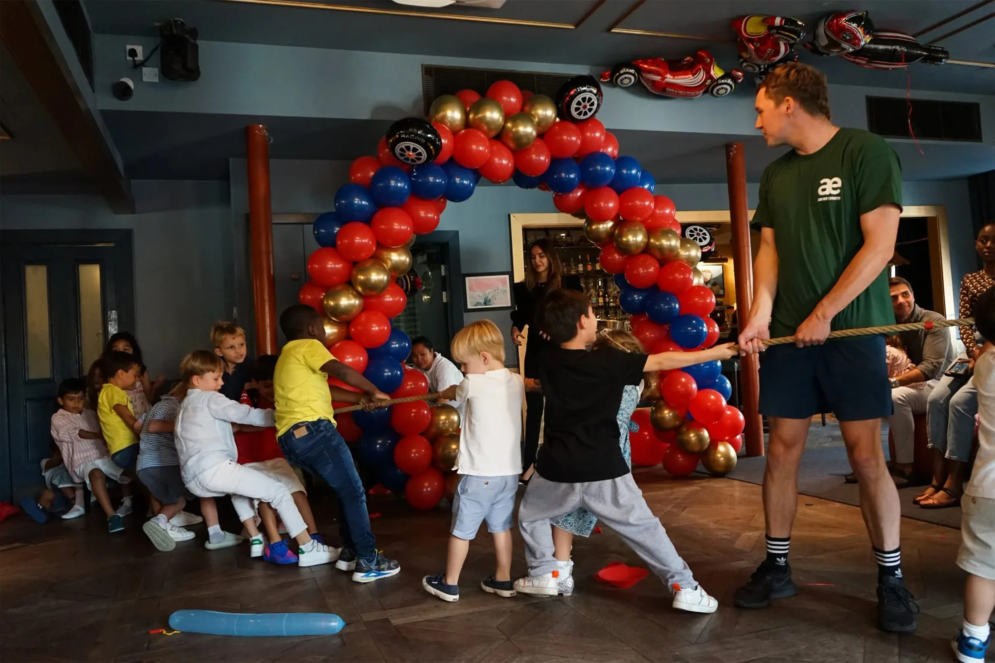 Children playing tug of war at a birthday party
